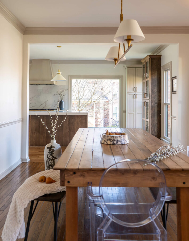 A view of the newly opened dining space that connects to the kitchen with luxury home design by Holly Thompson Design.